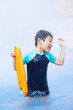Foto: Boy having fun in the swimming pool, water park Boy having fun in the swimming pool, water park