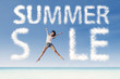 Summer sale clouds and woman jumping at beach
