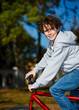 Urban biking - teenage boy and bike in city park