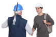 Photo: Construction worker with his trainee. Construction worker with his trainee.