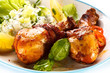 Photo: Grilled chicken legs and vegetables on white background Grilled chicken legs and vegetables on white background