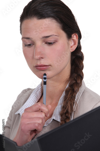 Photo: A businesswoman reading. A businesswoman reading.