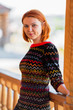 Portrait of beautiful red-haired young woman