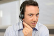 Photo: male telemarketer at work male telemarketer at work