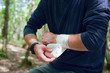 Photo: Applying an arm medical bandage Applying an arm medical bandage