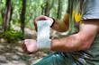 Photo: Applying an arm medical bandage Applying an arm medical bandage