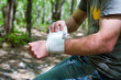 Photo: Applying an arm medical bandage Applying an arm medical bandage