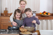 Photo: Mum and girls making pancakes Mum and girls making pancakes