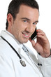 Doctor on phone smiling