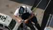 Man Washing Windows at Height, Modern Skyscraper