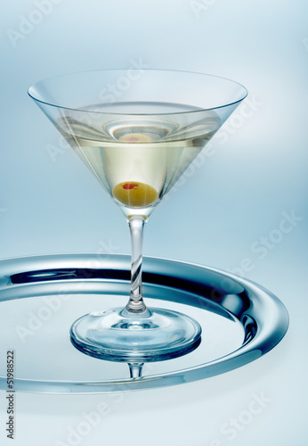 Photo: Glass of martini with olive Glass of martini with olive