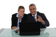 Business couple laughing