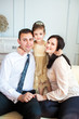 Photo: A family portrait of parents and their daughter A family portrait of parents and their daughter