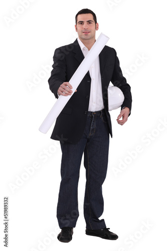 Photo: Young architect with plans in hand Young architect with plans in hand
