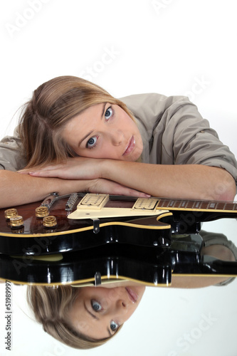 Photo: A cute blond with a guitar A cute blond with a guitar