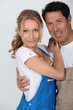 Foto: Couple wearing work overalls Couple wearing work overalls