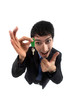 A crazy businessman handing a key.
