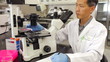Video: Male Scientist Using Microscope In Laboratory Male Scientist Using Microscope In Laboratory
