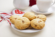 delicious apple biscuits on wooden table with heart decorations