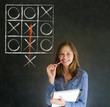 Thinking out of the box woman on blackboard background