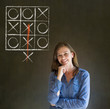 Thinking out of the box woman on blackboard background