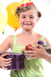 Little girl at birthday party with lots of gifts