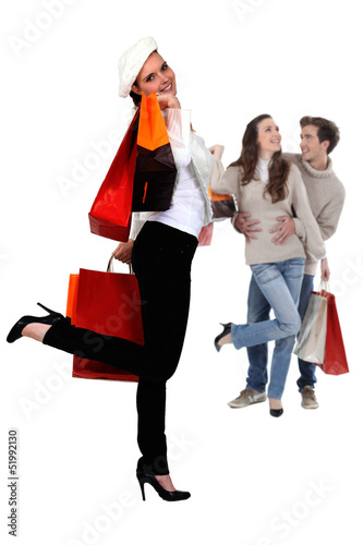 Photo: Three people with shopping bags Three people with shopping bags