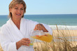 Photo: Woman pouring herself juice Woman pouring herself juice