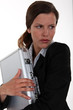 Foto: Woman protecting a briefcase Woman protecting a briefcase