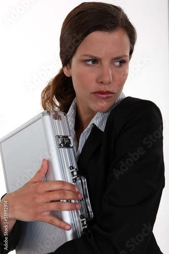Photo: Woman protecting a briefcase Woman protecting a briefcase