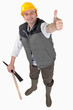 Photo: Delighted laborer with thumb up Delighted laborer with thumb up
