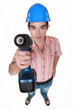 Tradesman holding a power tool