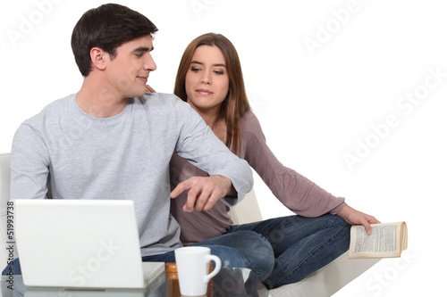 Photo: Young couple with laptop Young couple with laptop