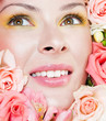 Photo: beautiful woman's face, surrounded by flowers beautiful woman's face, surrounded by flowers
