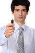 businessman holding a flash drive
