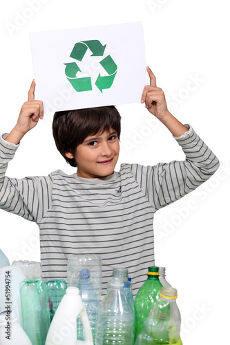 Photo: Small boy holding recycle logo Small boy holding recycle logo