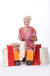Photo: gorgeous blonde with shopping bags isolated on white gorgeous blonde with shopping bags isolated on white