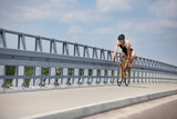 triathlete - biker starting riding on race bike