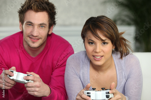 Photo: Couple playing video games Couple playing video games
