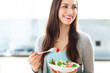 Woman eating salad