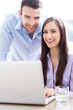 Photo: Business people using laptop Business people using laptop
