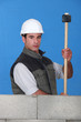 Foto: Workman with a sledgehammer Workman with a sledgehammer