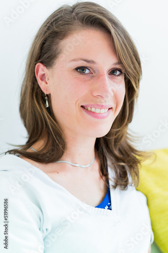 Photo: Real young woman on the couch Real young woman on the couch