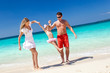 Happy family having fun on beach