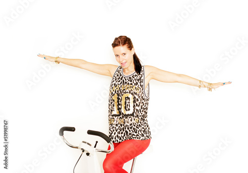 Photo: sportliche Frau auf Trimmrad sportliche Frau auf Trimmrad