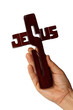 A wooden cross in hand
