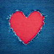 Blue denim background with red heart