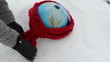 earth globe lie winter snowbank hand gloves put scarf