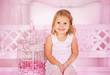 Photo: girl sitting on a bench in the room girl sitting on a bench in the room