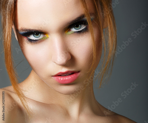 Photo: Magnetism. Character. Young Red Hair Beauty. Colorful Eye Makeup Magnetism. Character. Young Red Hair Beauty. Colorful Eye Makeup